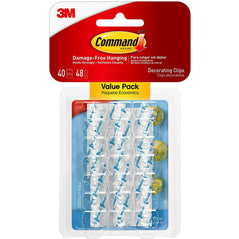 Small 3M Command decorating clips in clear, designed for easy hanging and organizing on walls or surfaces.