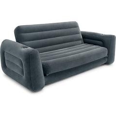 Intex inflatable pull-out sofa with blue and gray fabric, featuring armrests and a fold-out bed in a living room setting.